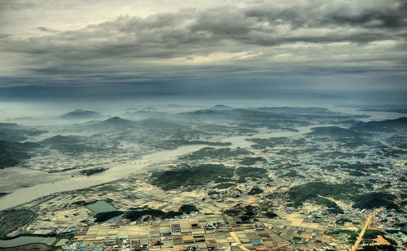 an aerial view of a city with mountains in the background, by Jang Seung-eop, pexels contest winner, hyperrealism, floating lands in-clouds, korean countryside, taken in the late 2010s, instagram post