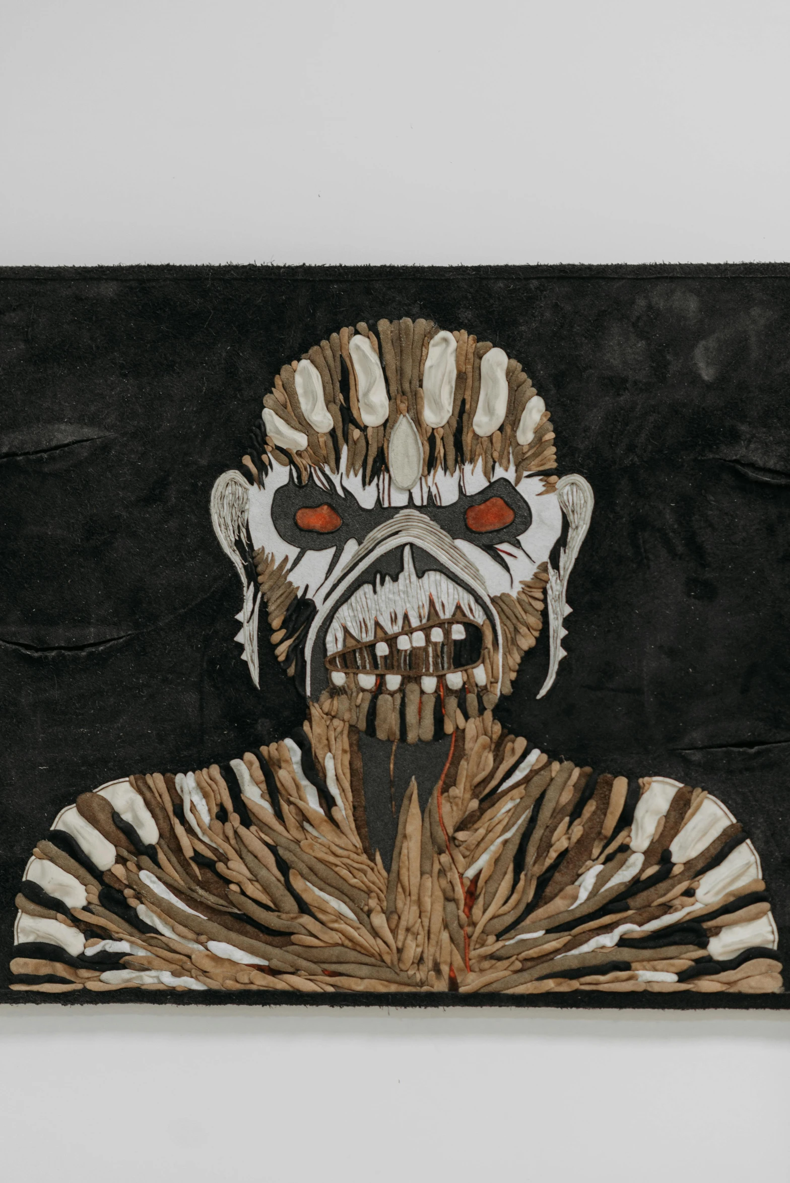 a close up of a painting on a wall, an album cover, inspired by William Mossman, reddit, cheesy iron maiden motifs, made of paper, in front of a black background, photo courtesy museum of art