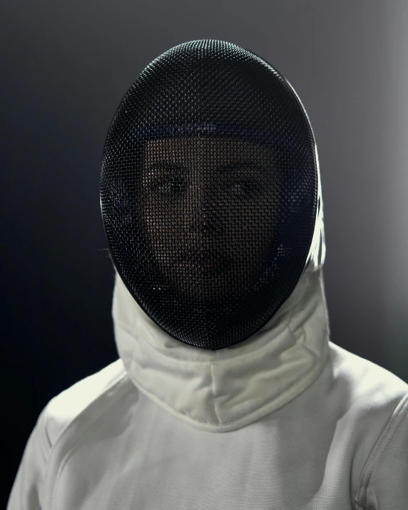 a close up of a person wearing a fencing mask, by Adam Marczyński, unsplash contest winner, neo-figurative, beautiful woman in spacesuit, looking serious, white uniform, charli xcx