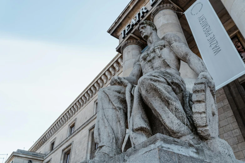 a statue of a man sitting on a chair in front of a building, inspired by Carel Willink, pexels contest winner, neoclassicism, view from ground level, official courthouse, split near the left, thumbnail