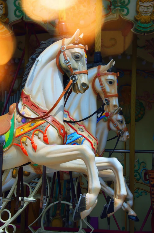 a close up of a horse on a carousel