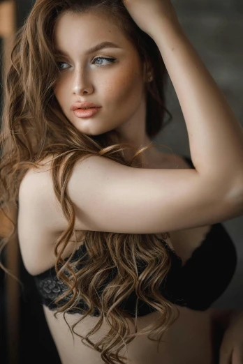 a woman in a black bra top posing for a picture, a portrait, trending on pexels, renaissance, hair : long brown, ekaterina, medium format. soft light, wavy