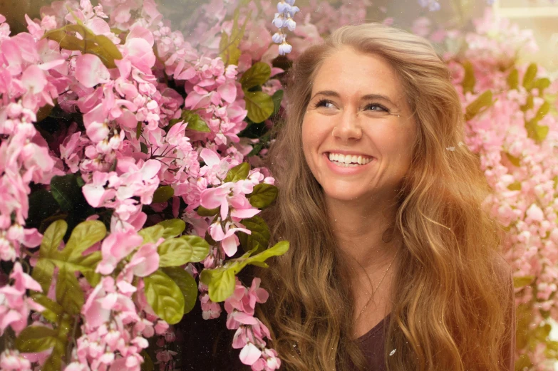 a woman standing in front of a bunch of flowers, avatar image, amy adams, joanna gaines, close - up photograph