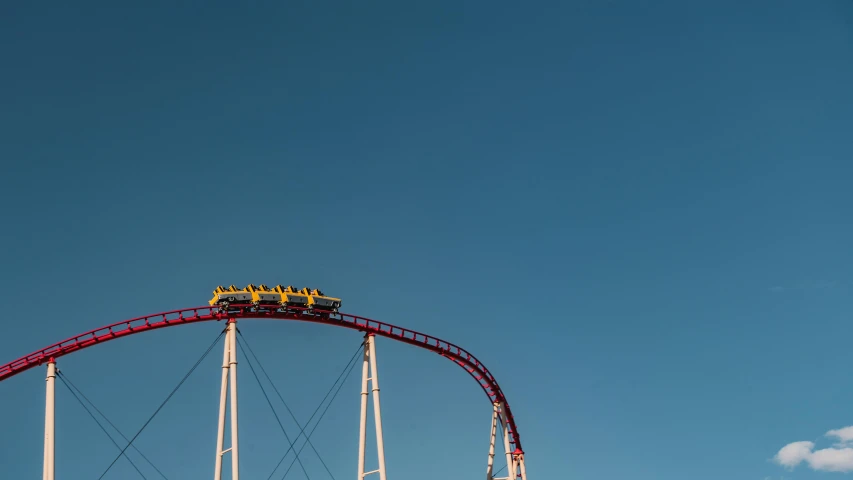 a roller coaster against a blue sky with clouds, pexels contest winner, aestheticism, yellow and red, mammoth, eight eight eight, avatar image