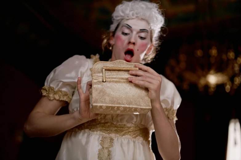 a woman in a white dress holding a purse, inspired by Pietro Longhi, pexels contest winner, rococo, performing, drag, square, [ theatrical ]