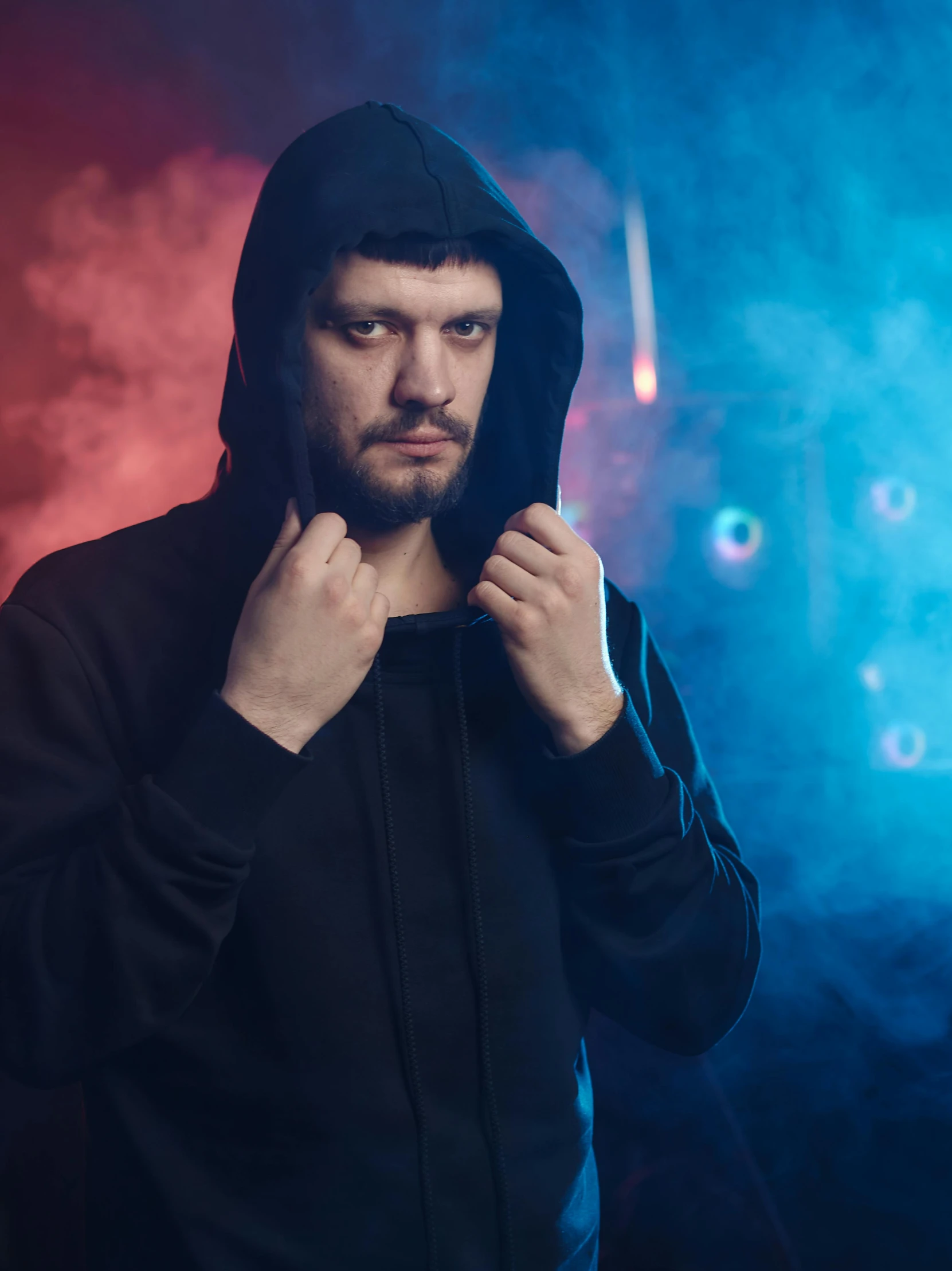 a man in a hoodie poses for a picture, by Adam Marczyński, ernest khalimov body, profile image, lights, ( ( theatrical ) )