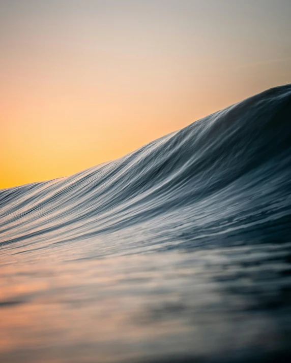 a person riding a surfboard on top of a wave, by Adam Marczyński, unsplash contest winner, minimalism, vibrant sunset, water line surface, flawless structure, today\'s featured photograph 4k