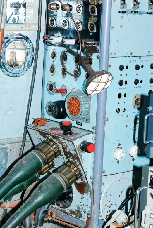 a close up of a control panel in a building, a portrait, by Ken Elias, modernism, in cockpit, blue submarine no. 6, 1960s color photograph, may)