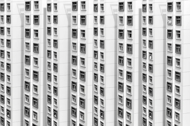 a black and white photo of a tall building, inspired by Cheng Jiasui, pexels contest winner, postminimalism, house windows, crowded, all white render, kowloon