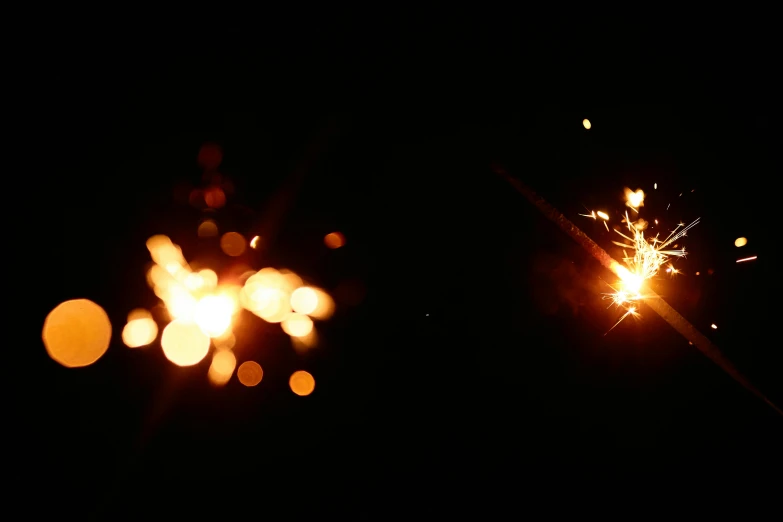 a couple of sparklers that are in the dark, pexels, hurufiyya, shot on sony alpha dslr-a300, abstract lighting, hd wallpaper, cinematic shot!