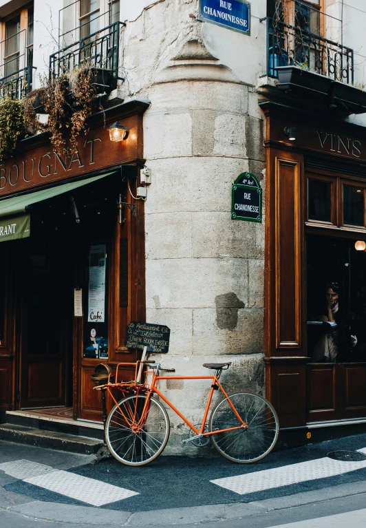 a bicycle parked in front of a building, pexels contest winner, renaissance, local bar, paris background, inspect in inventory image, facing away