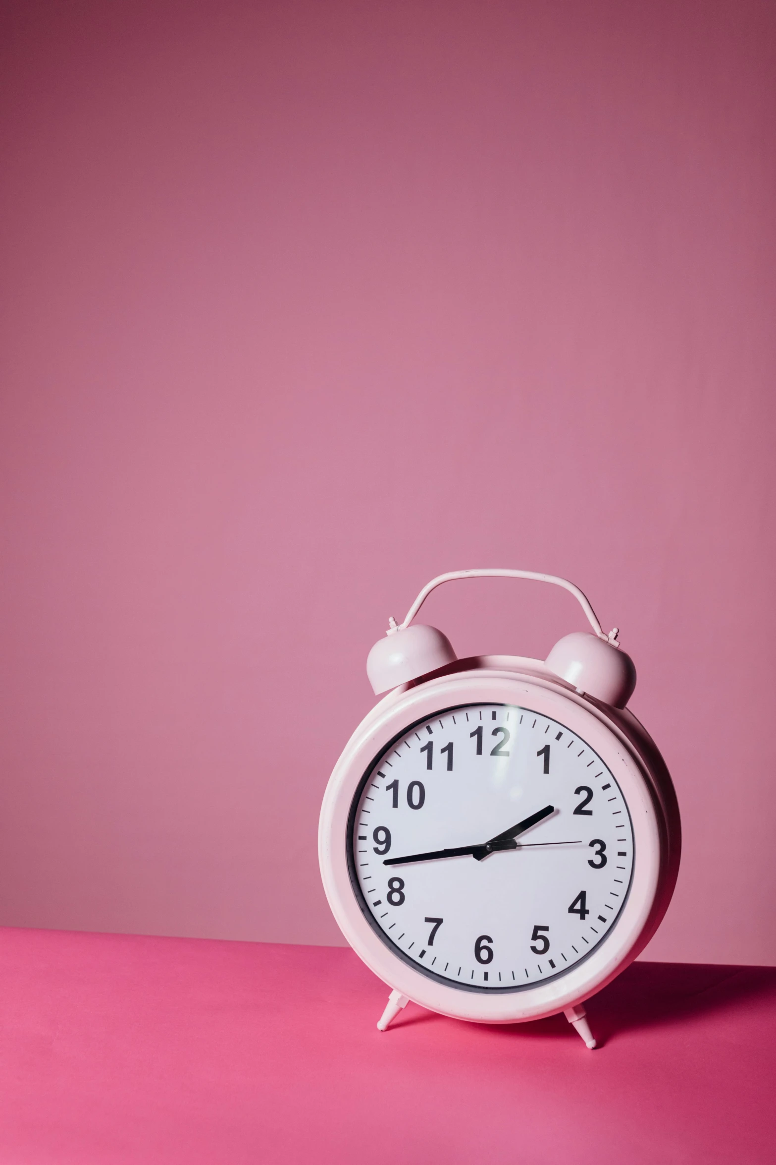a pink alarm clock on a pink surface, trending on pexels, timelapse, thumbnail, time + space + reality, high quality photo
