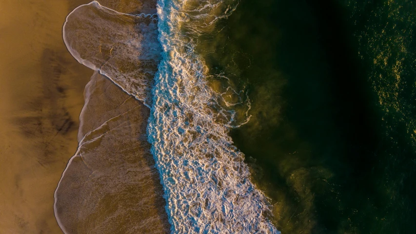 a person riding a surfboard on top of a sandy beach, by Brad Holland, pexels contest winner, conceptual art, arial shot, erosion algorithm landscape, evening sunlight, an abstract