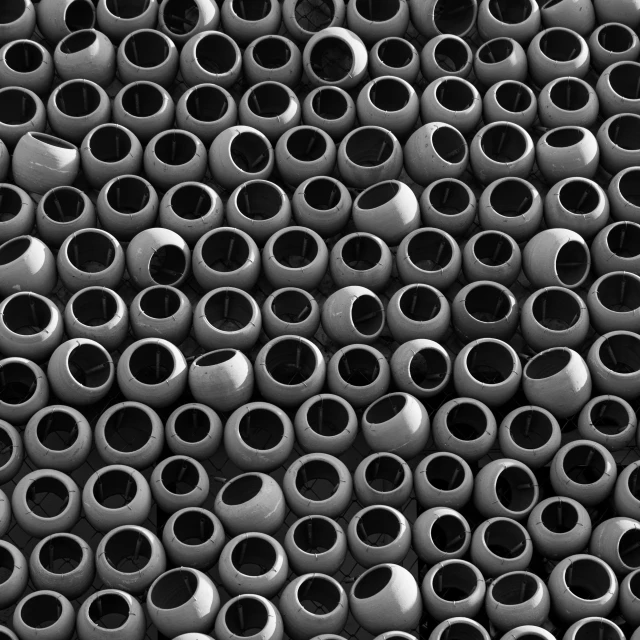 a black and white photo of a bunch of vases, inspired by Edward Weston, kinetic pointillism, under a microscope, steel pipes, bright macro view pixar, black round hole