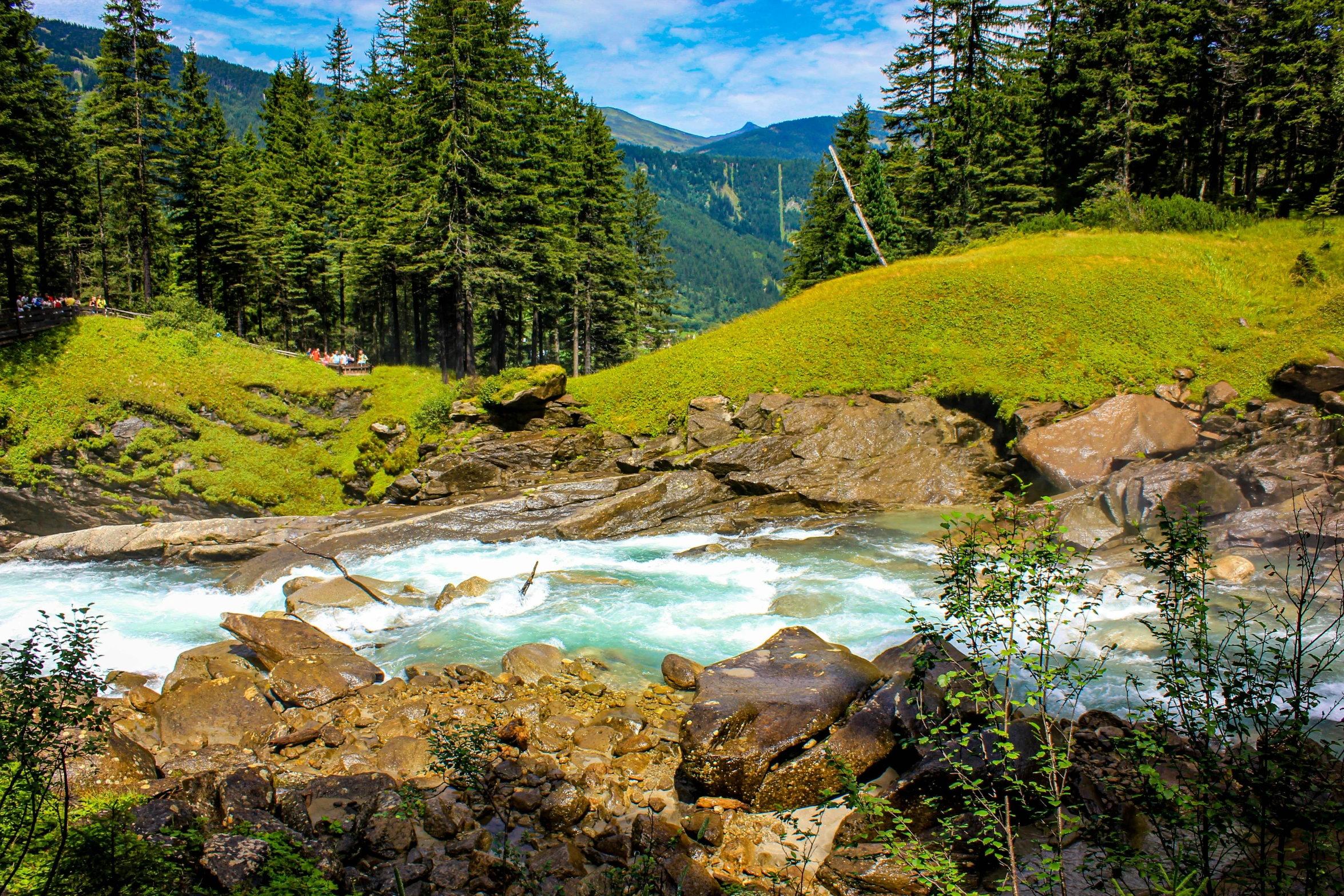 a river running through a lush green forest, hurufiyya, vacation photo, thumbnail