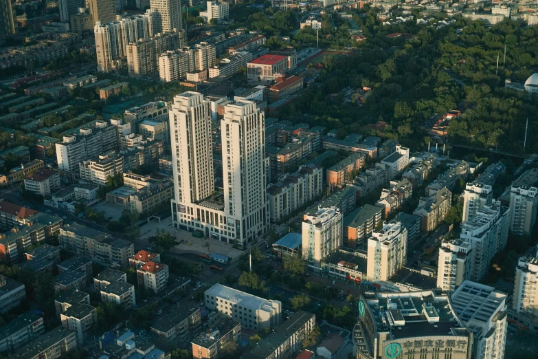 an aerial view of a city with tall buildings, nezha, hasbulla magomedov, single building, high res 8k
