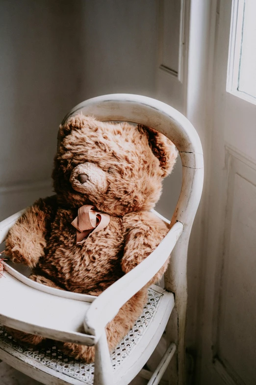 a brown teddy bear sitting in a white chair, pexels contest winner, romanticism, bashful expression, vintage aesthetic, kids, highly polished