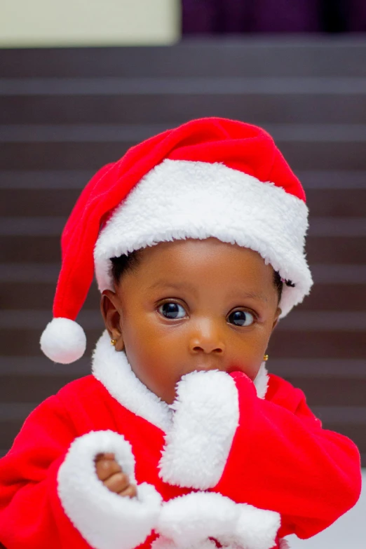 a close up of a child wearing a santa suit, an album cover, by Chinwe Chukwuogo-Roy, pexels, square, 15081959 21121991 01012000 4k, cutest, bl