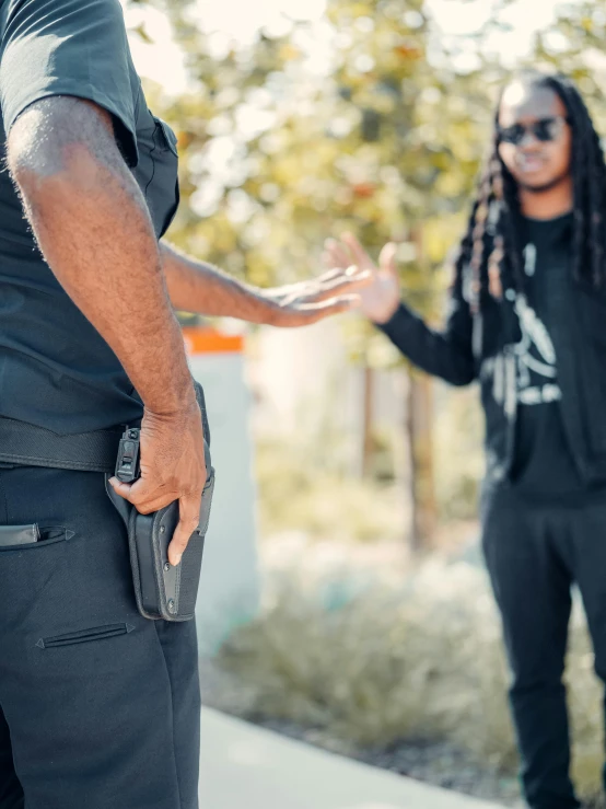 two men standing next to each other on a sidewalk, unsplash, renaissance, tactical vests and holsters, chief keef, profile image, arguing