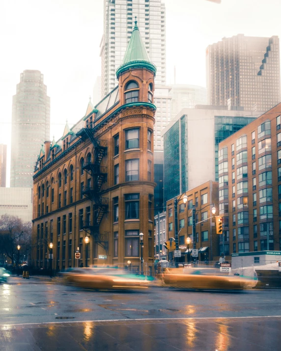 a city street filled with lots of traffic next to tall buildings, a colorized photo, pexels contest winner, toronto, victorian architecture, water tornado in the city, college