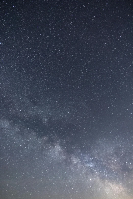 the milky shines brightly in the night sky, trending on unsplash, medium closeup, starry sky 8 k, grey, infinite