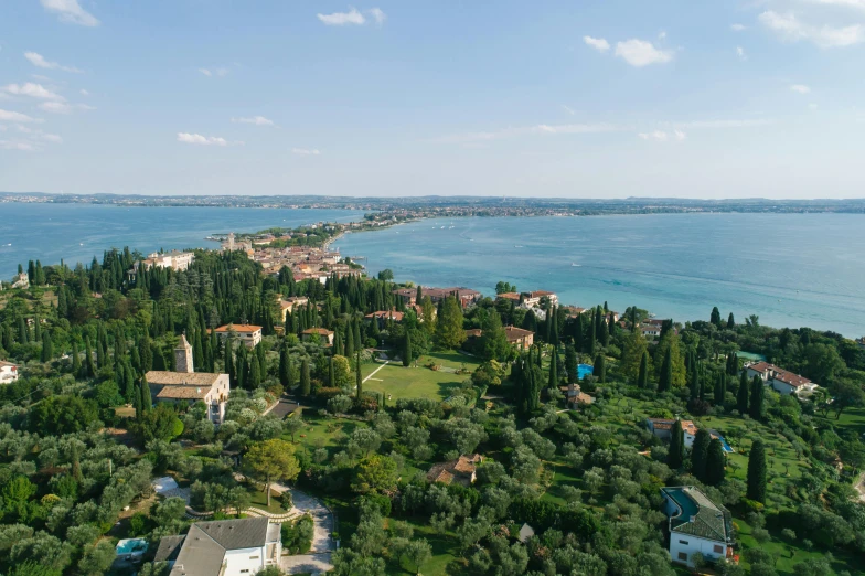 an aerial view of a small island in the middle of the ocean, inspired by Niccolò dell' Abbate, pexels contest winner, renaissance, formal gardens, venice biennale, panorama distant view, lake in foreground