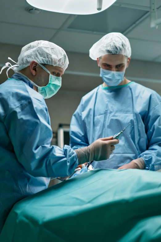 a group of surgeons performing surgery in an operating room, a picture, by Meredith Dillman, shutterstock, multiple stories, lgbtq, coronavirus, inspect in inventory image