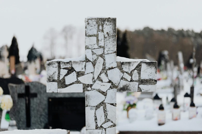 a close up of a cross in a cemetery, a marble sculpture, by Attila Meszlenyi, pexels contest winner, white snow, flattened, family photo, irregular