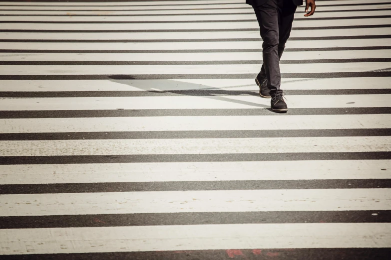 a man walking across a crosswalk holding an umbrella, pexels contest winner, figuration libre, square lines, striped, 15081959 21121991 01012000 4k, small steps leading down