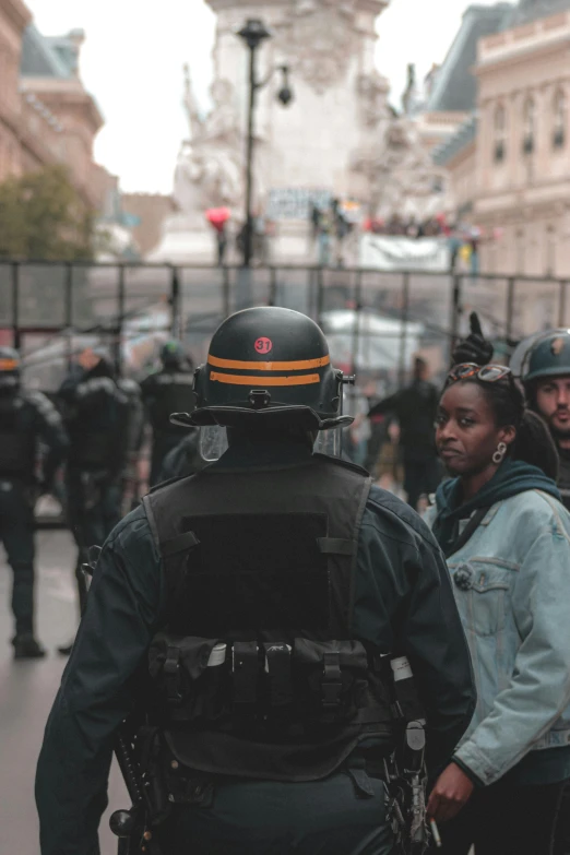 a group of police officers standing next to each other, pexels contest winner, renaissance, 30-year-old french woman, in the center of the frame, standoff, promo image