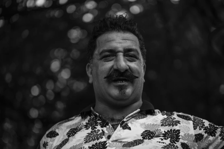 a black and white photo of a man with a mustache, by Daniel Lieske, sam nassour, with hawaiian shirt, amr elshamy, taken with canon 8 0 d