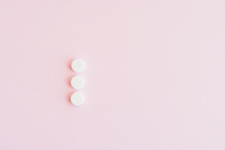 two white pills on a pink background, by Évariste Vital Luminais, trending on pexels, postminimalism, third trimester, 3 doors, panel, threes