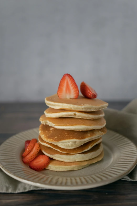 a stack of pancakes with strawberries on a plate, 6 pack, organics, smooth round shapes, soft skin