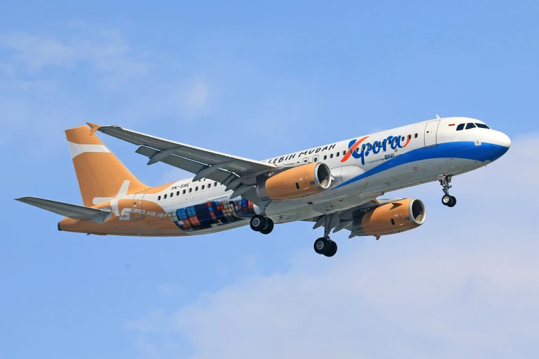 a large jetliner flying through a blue sky, a picture, cobra, orange and blue, espiritus, jerez, square