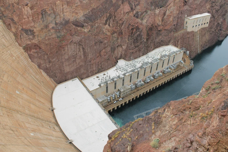 a large body of water with a dam in the background, by Dan Frazier, pexels contest winner, hurufiyya, las vegas, giants, slate, promo image