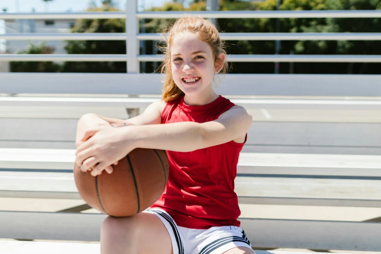 a girl sitting on a blea blea blea blea blea blea blea blea blea blea blea b, dribble contest winner, wearing red shorts, origin jumpworks, aged 13, 2019 trending photo