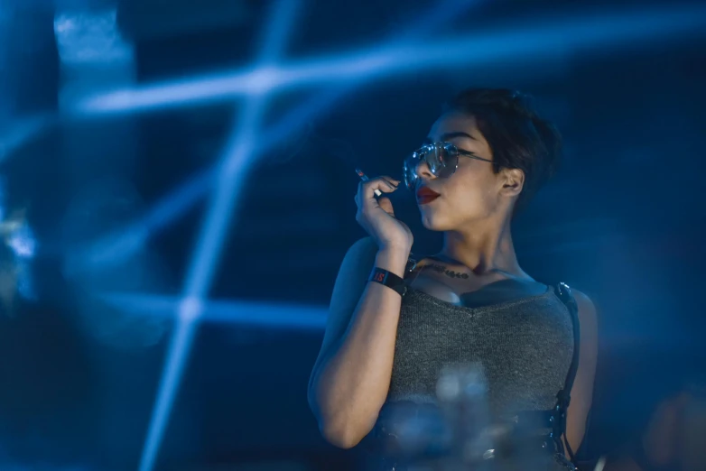 a woman is talking on a cell phone, by Adam Marczyński, pexels, holography, sci-fi night club, nerdy black girl super hero, shot on sony a 7 iii, tech glasses