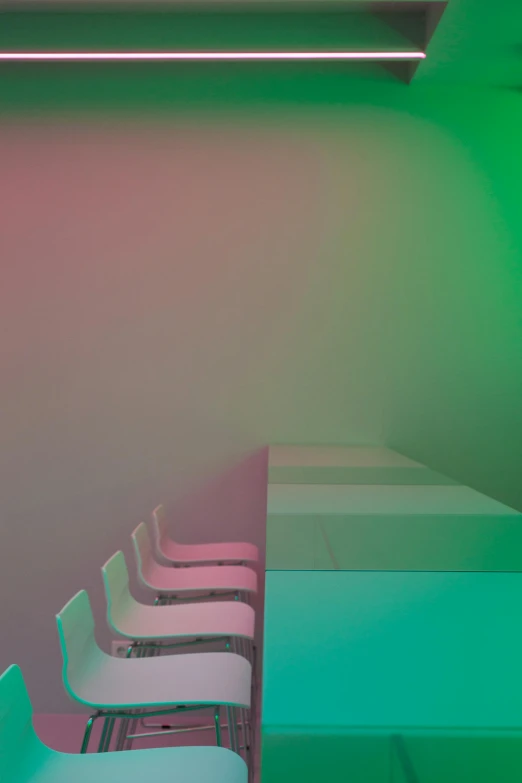 a group of white chairs sitting next to each other, by Peter Alexander Hay, color field, dichroic, verdant gradient, ( ( photograph ) ), containing tables and walls