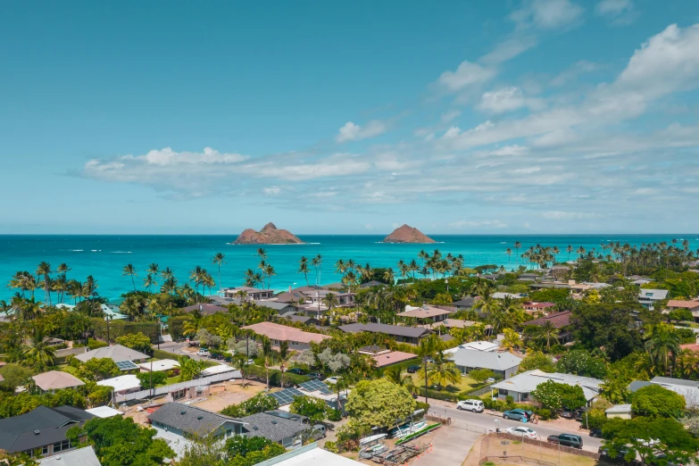 an aerial view of a small town in the middle of the ocean, by Carey Morris, hawaii beach, clear blue skies, katey truhn, pyramid surrounded with greenery