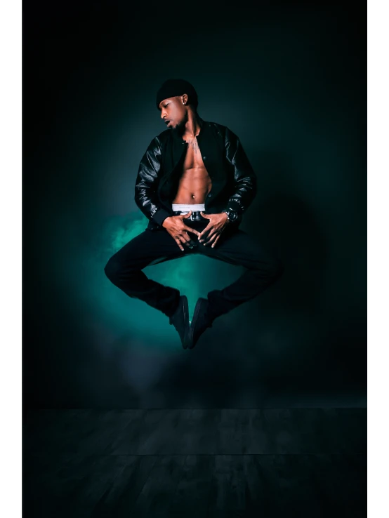 a man in a black jacket jumping in the air, inspired by Ludovit Fulla, art photography, black and green, portrait of combat dancer, studio!! portrait lighting, taken in the early 2020s