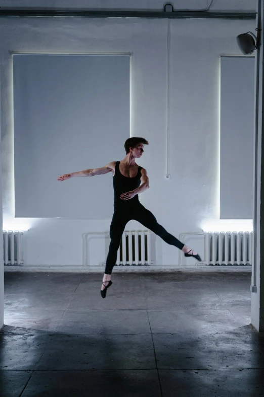 a man that is jumping in the air, by Elizabeth Polunin, an epic non - binary model, low quality photo, recital, profile pic