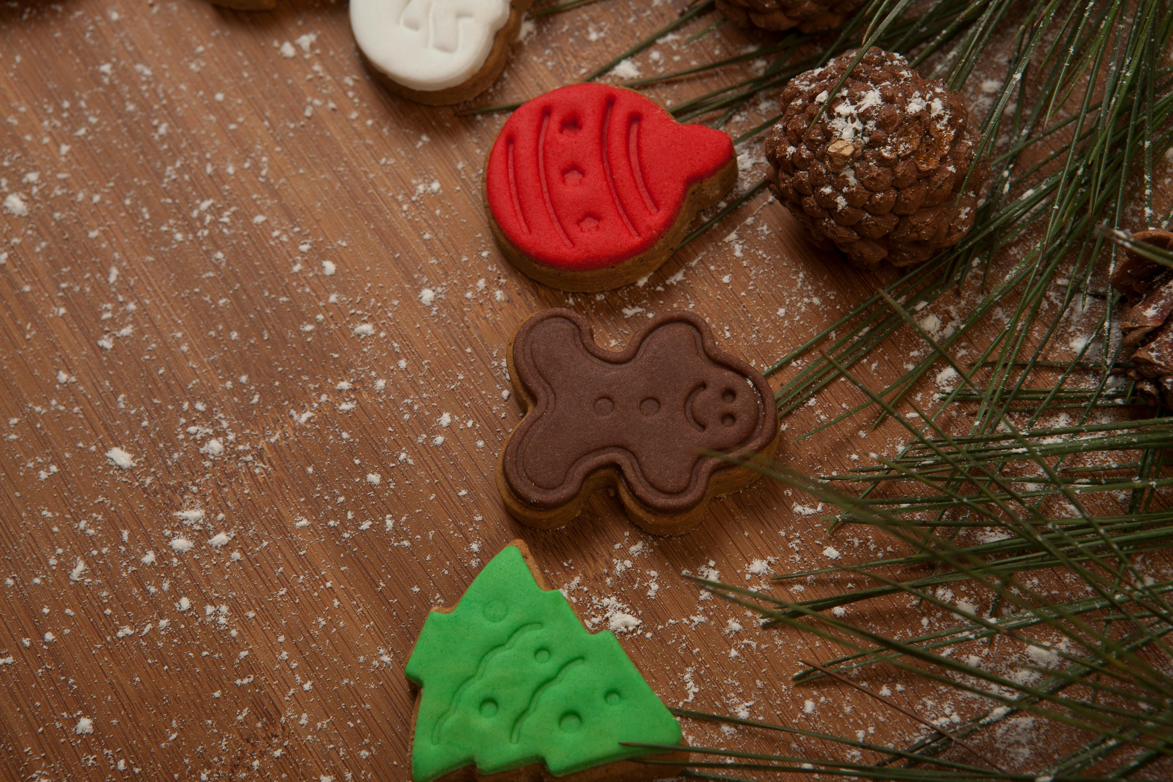 a couple of cookies sitting on top of a wooden table, a picture