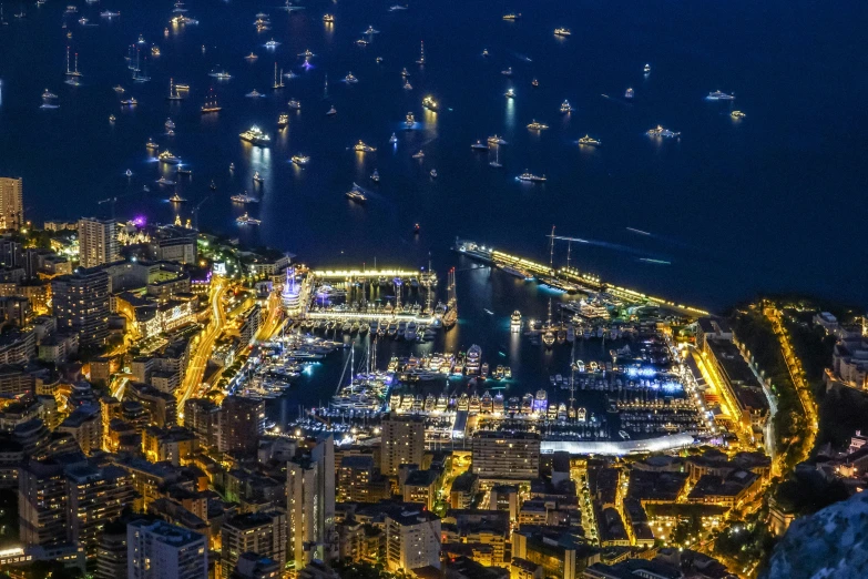 an aerial view of a city at night, pexels contest winner, renaissance, monaco, summer festival night, harbor, thumbnail