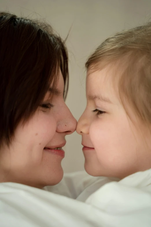 a close up of a child and a woman, profile pic, photograph, breeding, lesbian