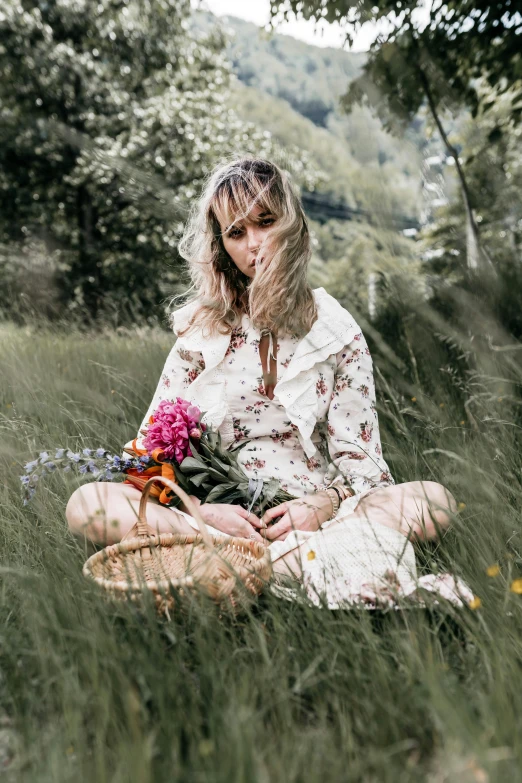 a woman sitting in a field with a basket of flowers, inspired by Konstantin Somov, pexels contest winner, hippie fashion, looking serious, sydney sweeney, casually dressed