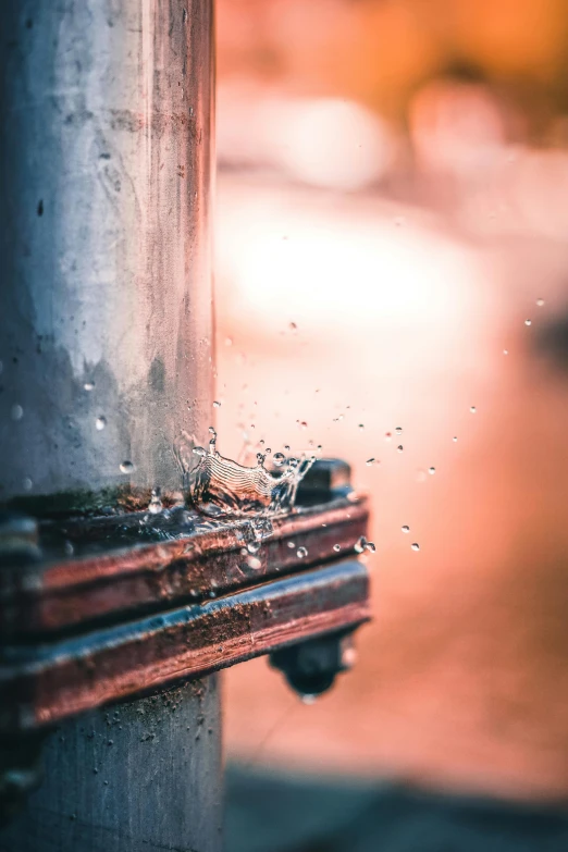 a close up of a fire hydrant on a street, by Niko Henrichon, pexels contest winner, fixing a leaking sink, steel pipes, rain sensor, macro up view metallic