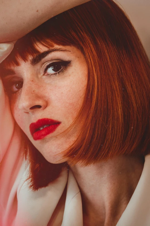 a woman with red hair wearing a hat, an album cover, inspired by Elsa Bleda, pexels, photorealism, with a bob cut, handsome girl, red eyed, jaw dropping beauty