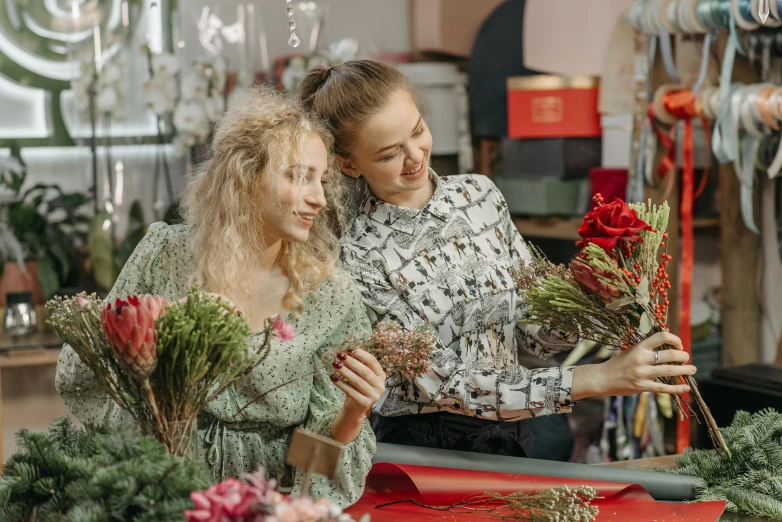 two women are working in a flower shop, by Julia Pishtar, pexels contest winner, arts and crafts movement, avatar image, festive atmosphere, still frame, small in size