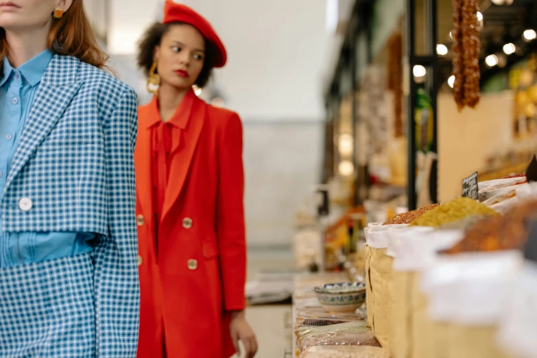 a couple of women standing next to each other, trending on pexels, renaissance, inspect in inventory image, red suit, snacks, straw hat and overcoat