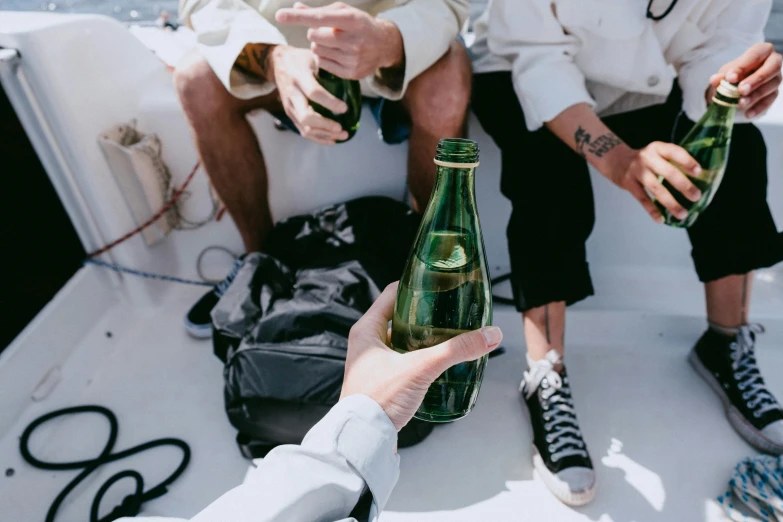 a couple of people that are sitting on a boat, pexels contest winner, renaissance, white wine bottle, trending on vsco, holding beer bottles, subtle detailing